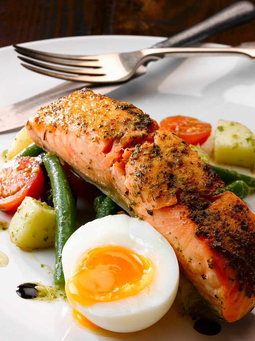 Fried, marinated salmon with salade Nicoise and a soft boiled egg
