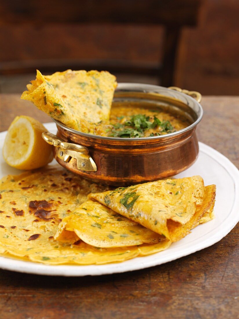 Coriander pancakes with dal
