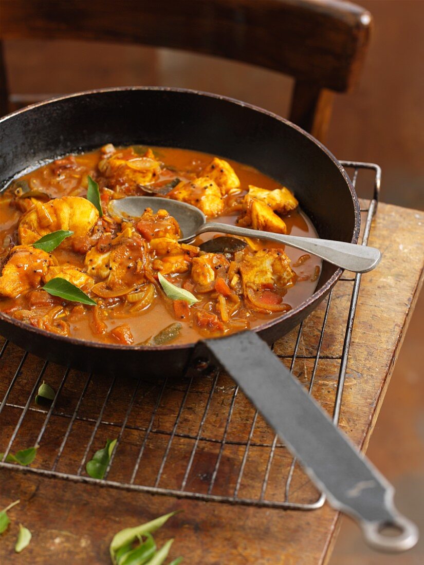 Fish curry in a pan