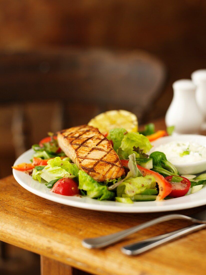 Grilled salmon fillet with a mixed leaf salad