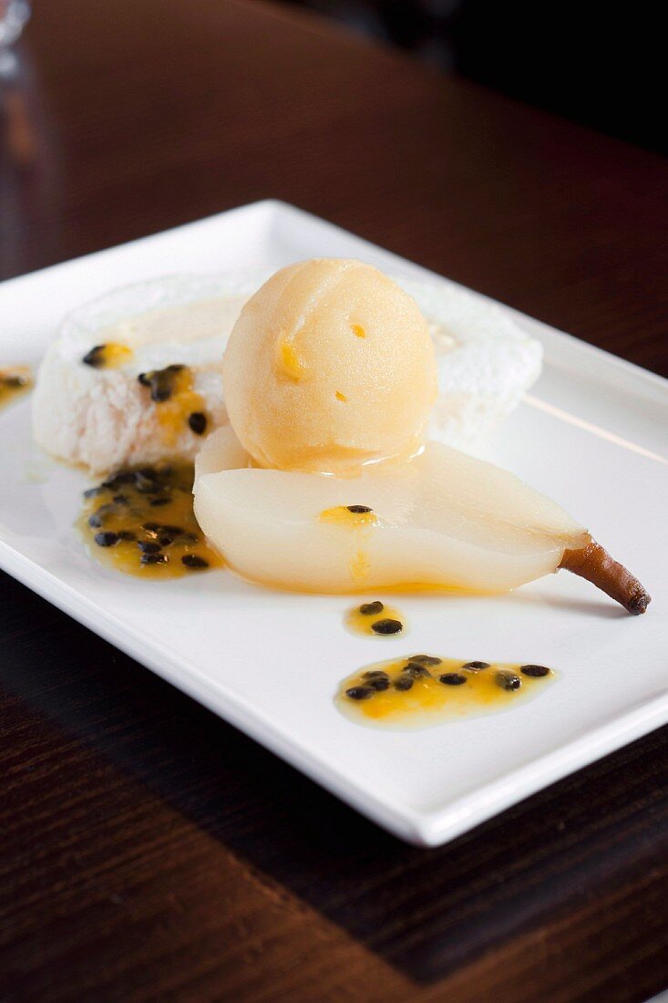 Meringue roll with poached pear and passion fruit sorbet