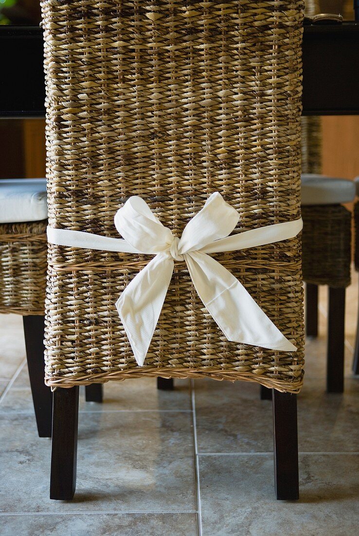 Bow tied around wicker dining chair