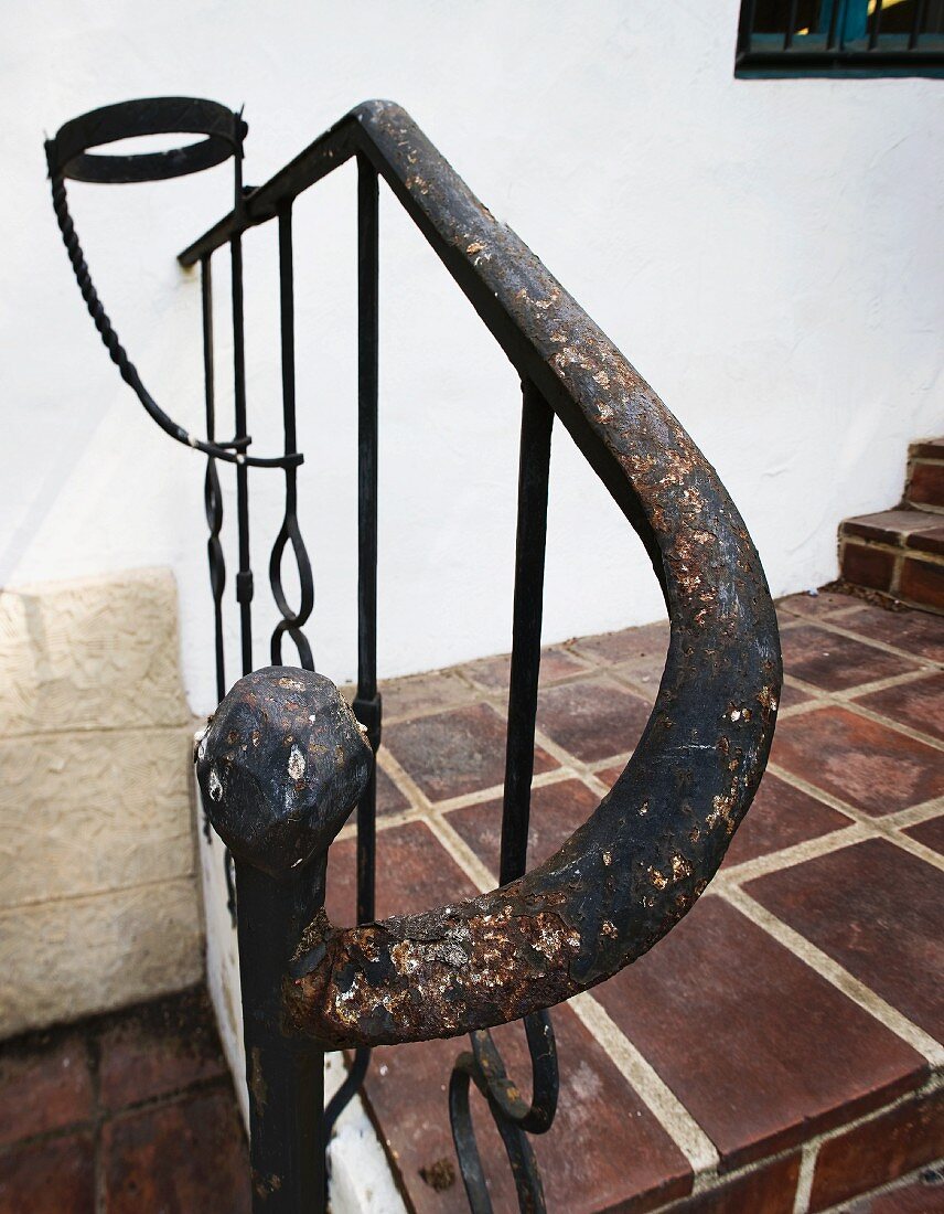 Detail worn wrought iron hand rail