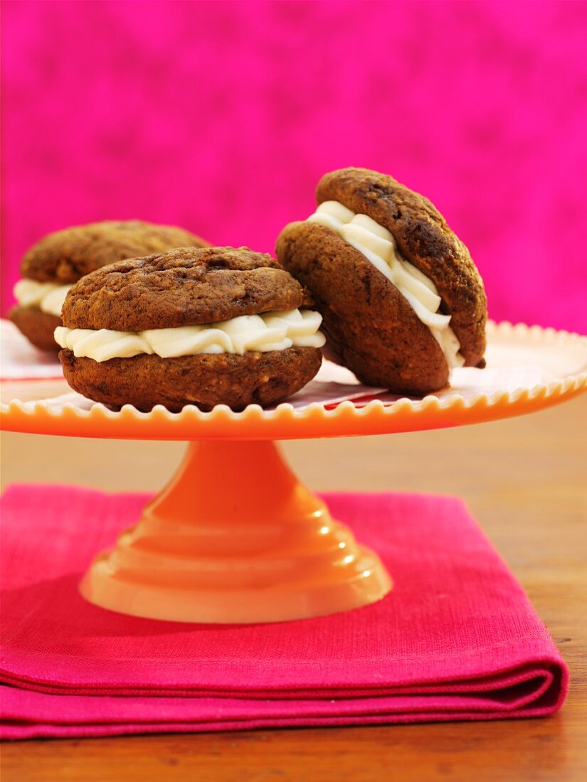 Chocolate and ginger whoopie pies filled with cream