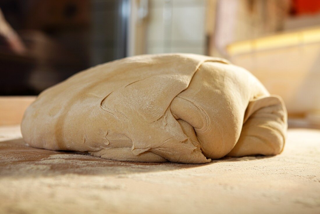 Bread dough on a floured work surface