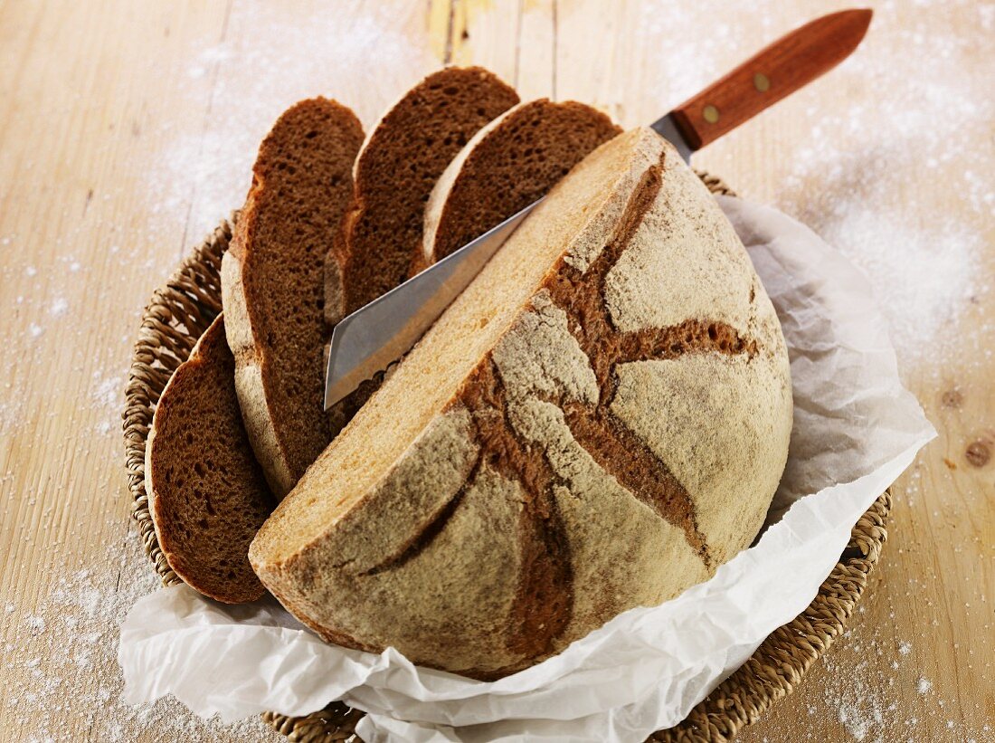 Sliced country bread in a bread basket