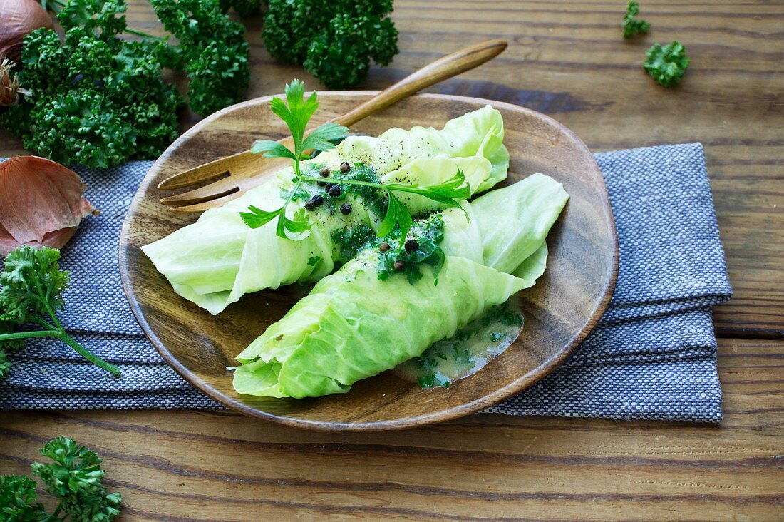 Cabbage wraps on a wooden plate