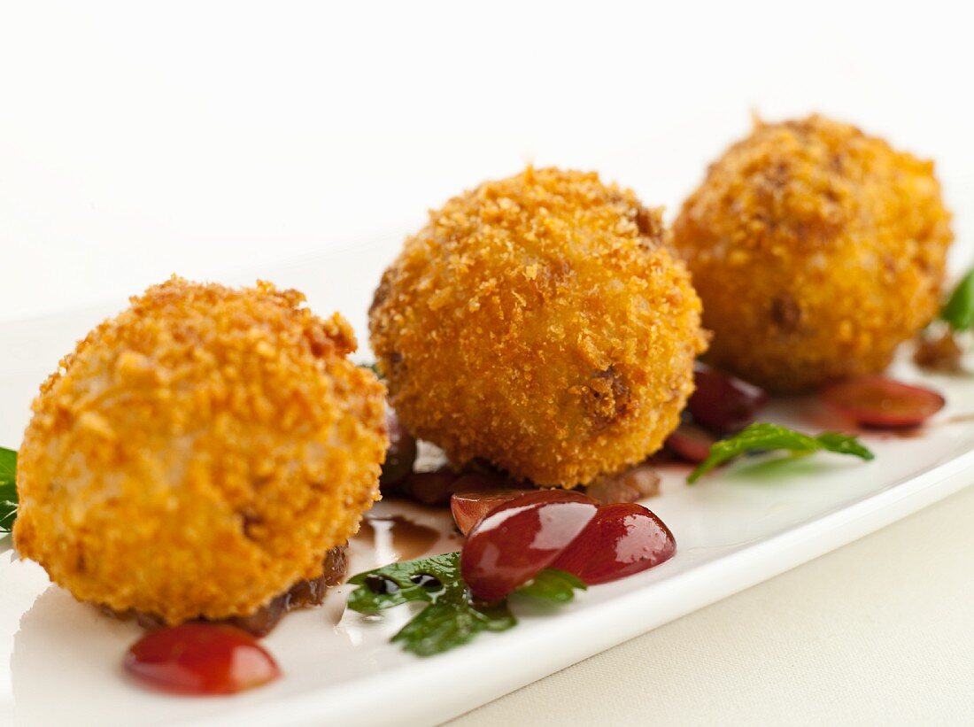 Arancini (breaded and fried rice balls, Italy)