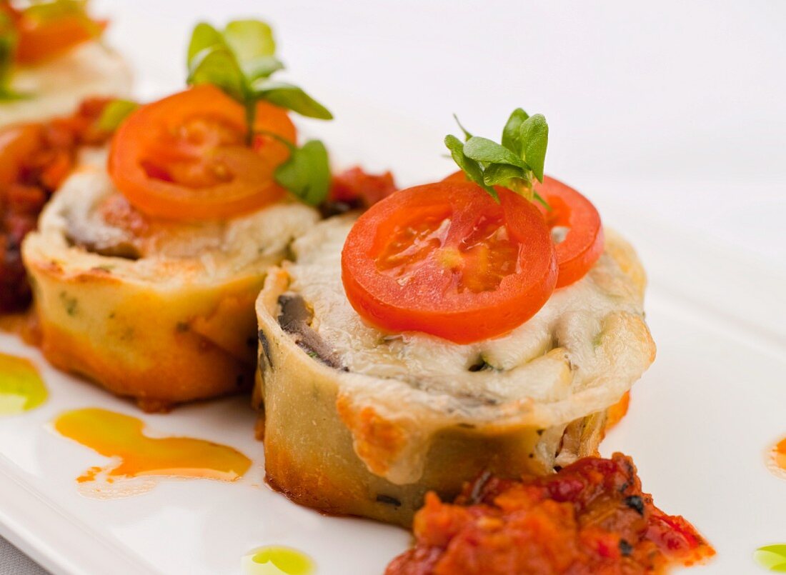 Pasta Timbale with Ground Lamb Filling Topped with Mozzarella and Tomato