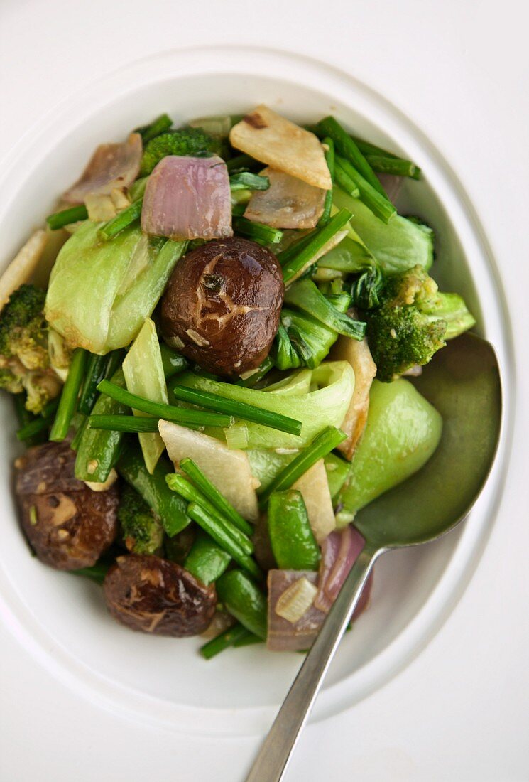 Stir Fried Vegetables in a Bowl with a Spoon; From Above