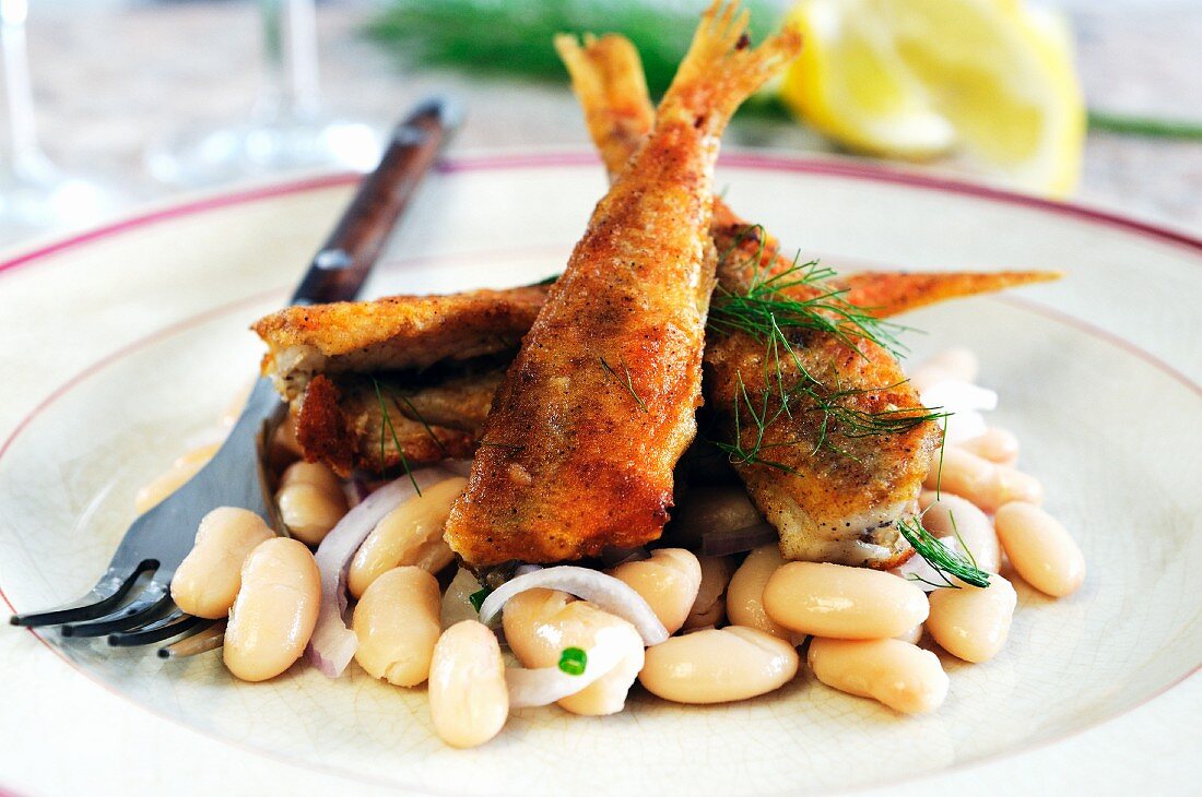 Fried goatfish on a bean salad