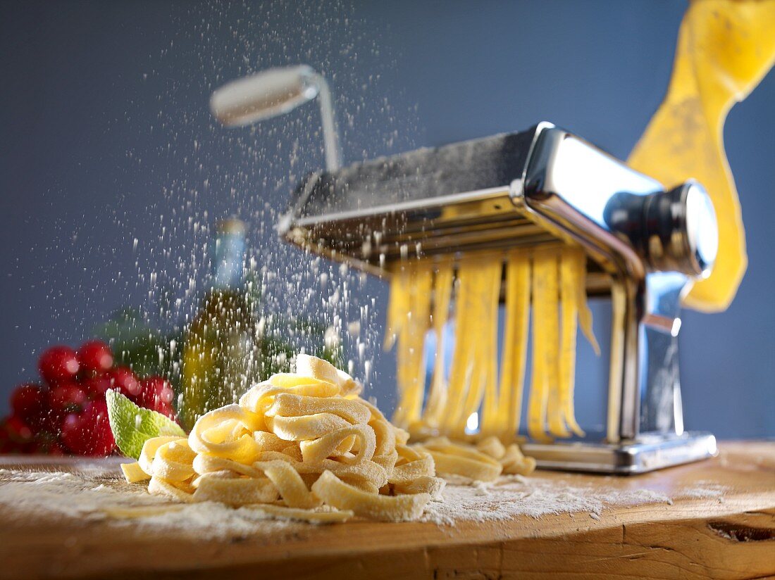 Fresh pasta being dusted with flour
