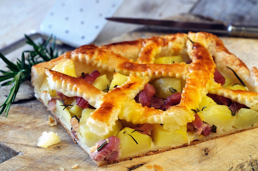 A slice of lattice potato and ham pie