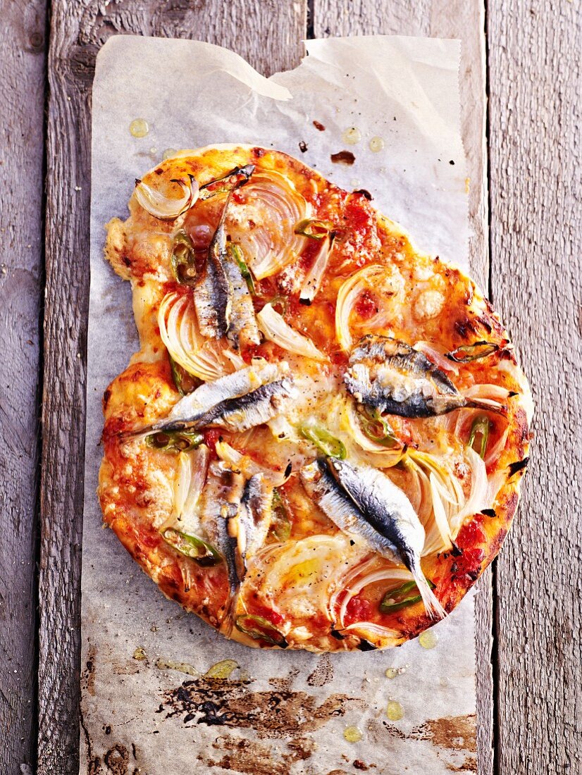 A sardine, onion and chilli pizza