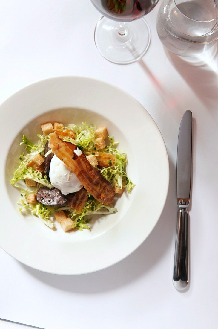 Duck liver with frisee lettuce and poached egg