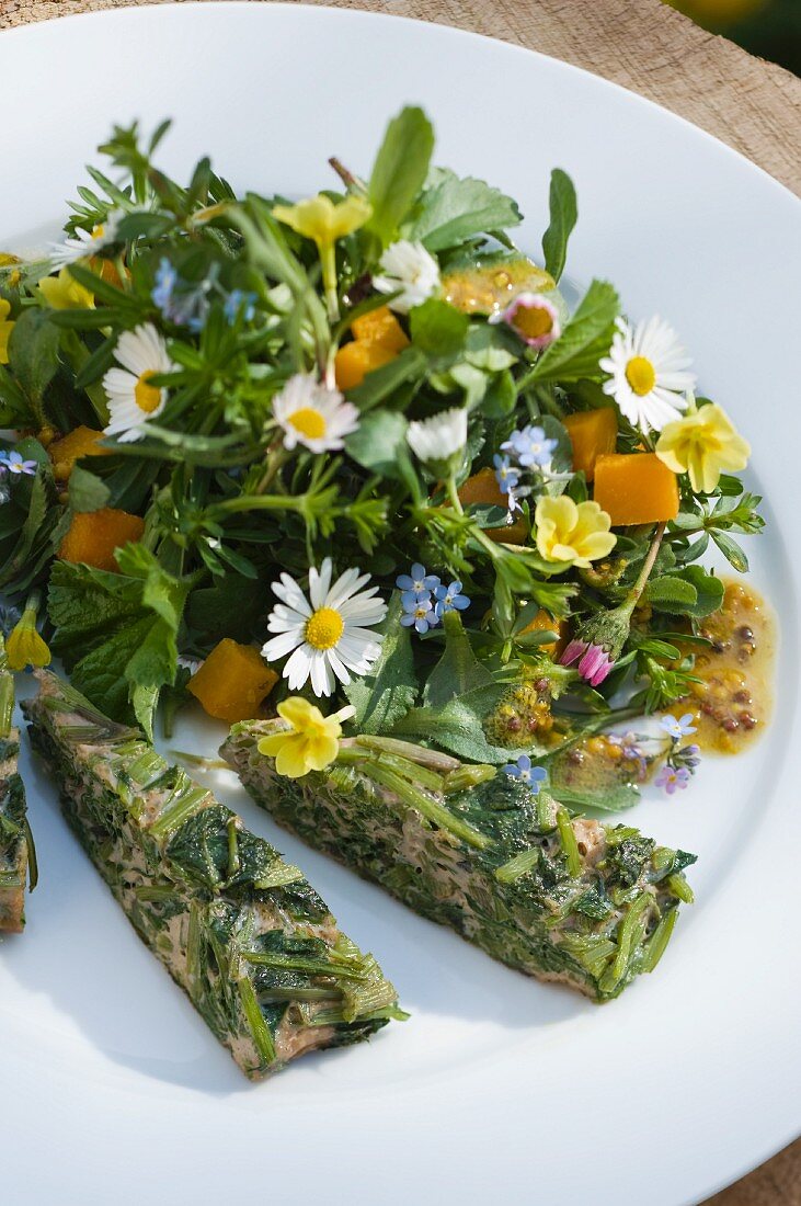 Spring herb salad with edible flowers and frittata