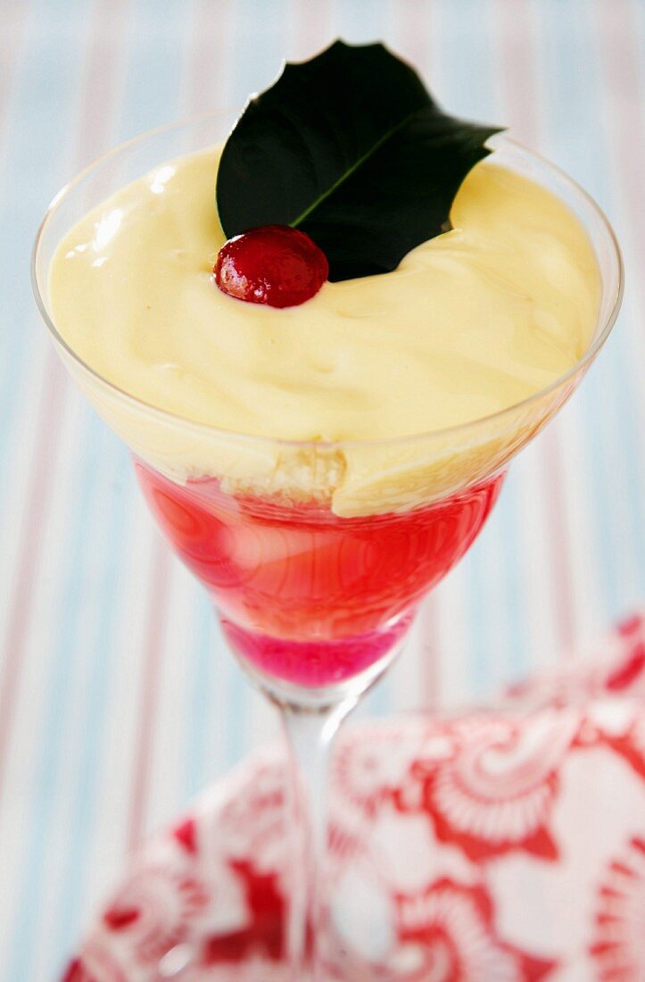 A layered dessert with strawberry jelly and vanilla cream