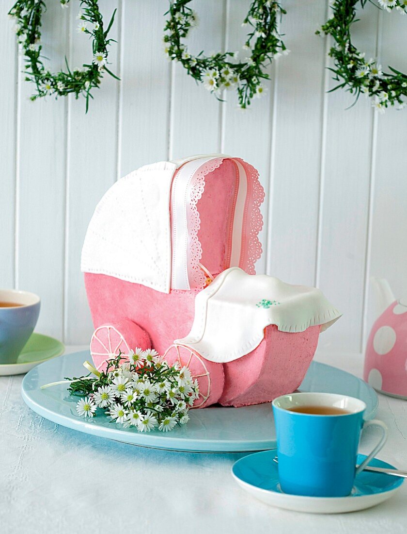 A sweet pram with raspberry icing