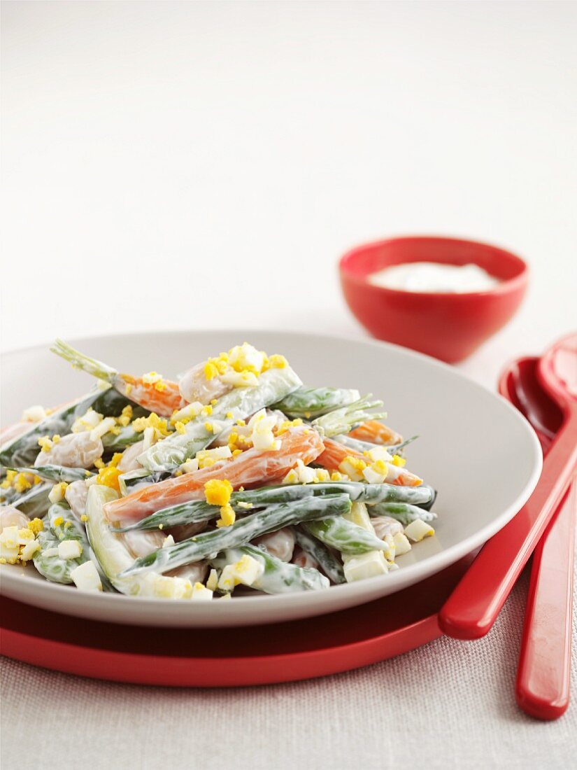 Vegetable salad with egg and yogurt