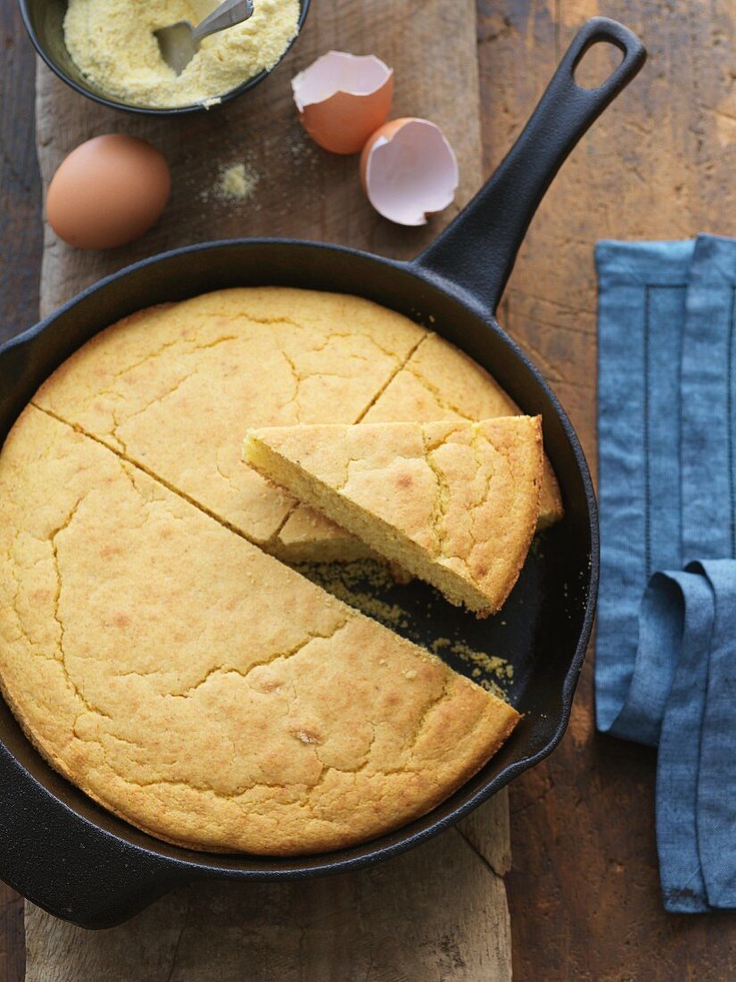 Cornbread in a Cast Iron Skillet; Slice Removed; From Above