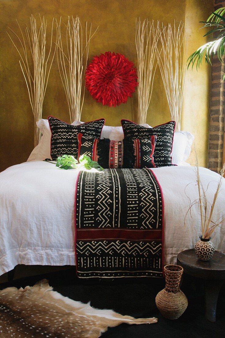 Black white and red decorative pillows and bed runner