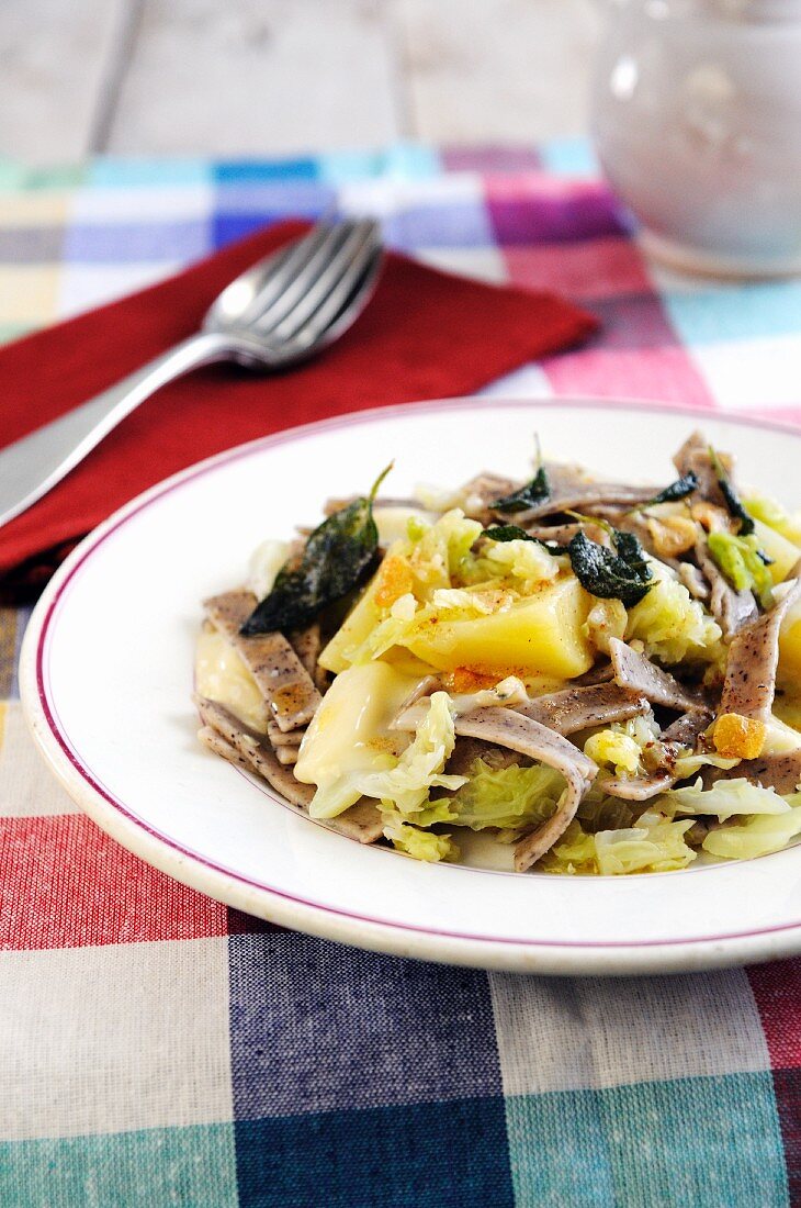 Buckwheat pasta with potatoes, cabbage and taleggio cheese