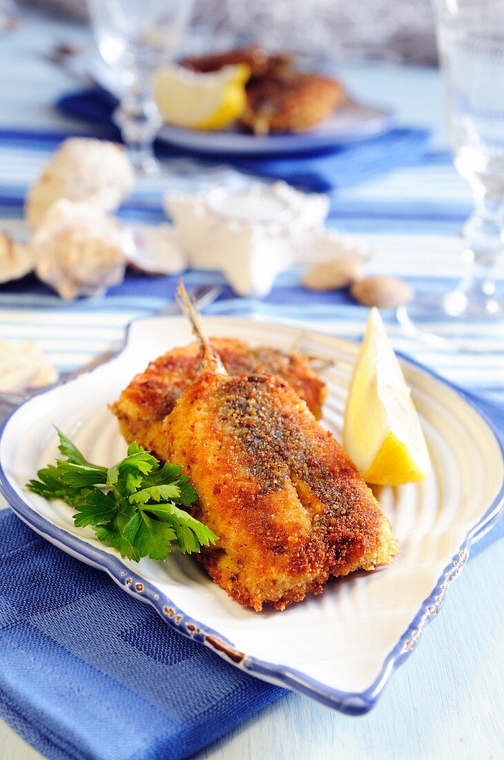 Stuffed and breaded fillets of anchovies
