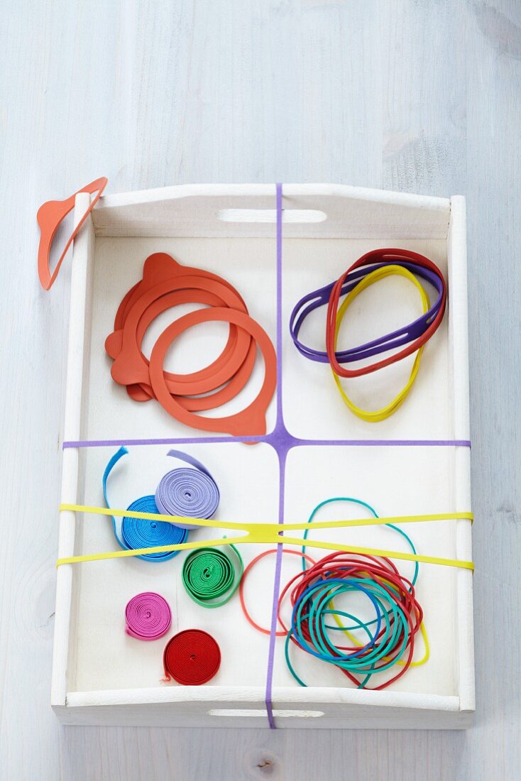 Various rubber bands on tray