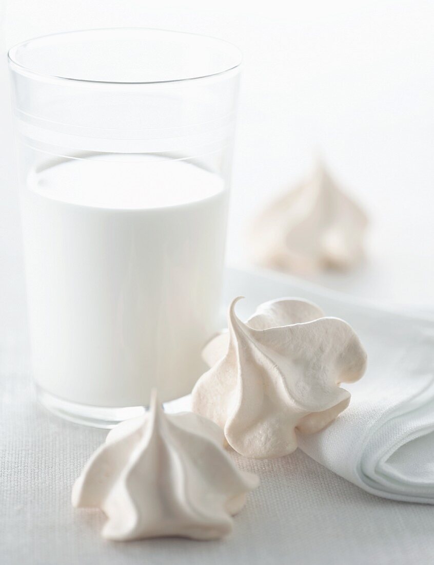 Glass of Milk with Meringue Cookies