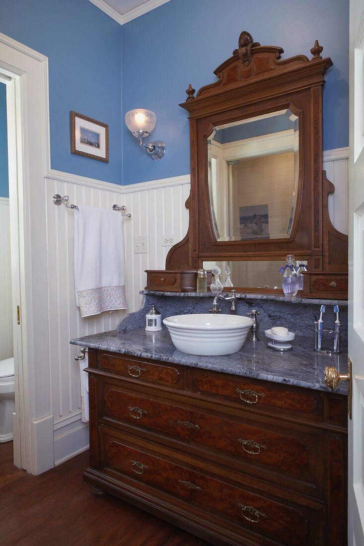 Antique washstand with marble counter and integrated mirror