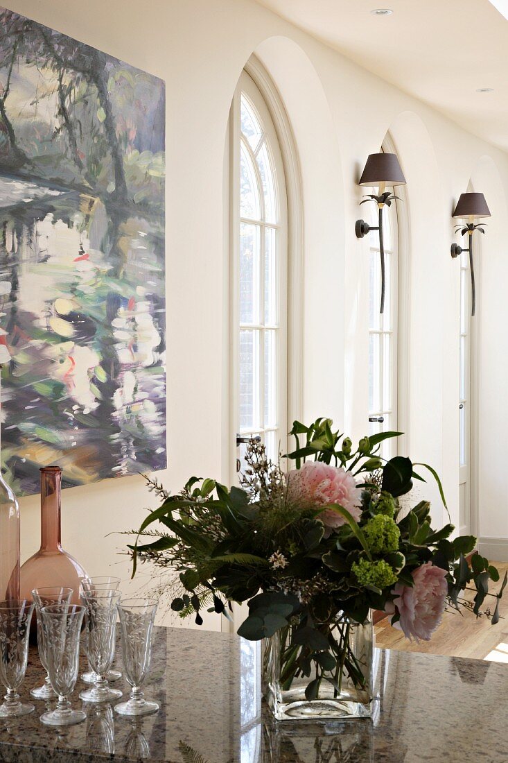 Bouquet in glass vase on stone slab in classic traditional ambiance