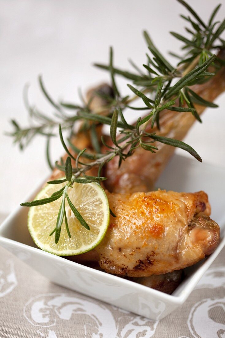 Roast chicken legs with lime and rosemary