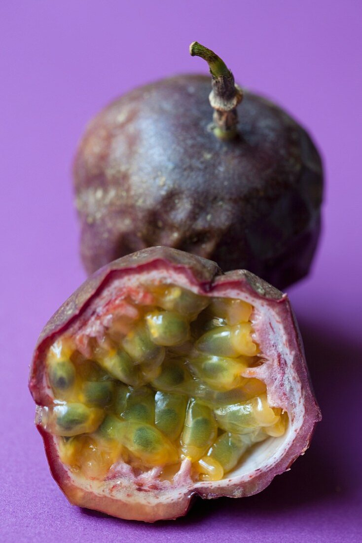 Passion fruits, whole and halved