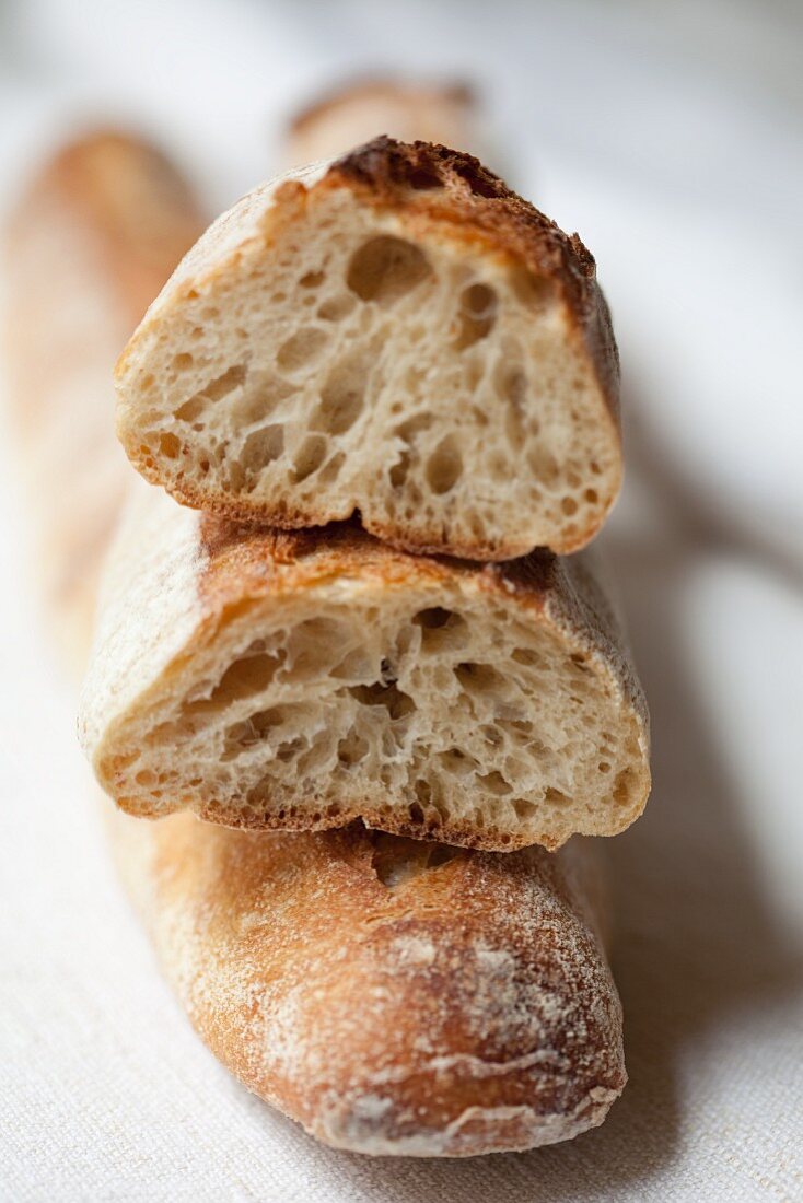 Baguette, whole and slice (close-up)