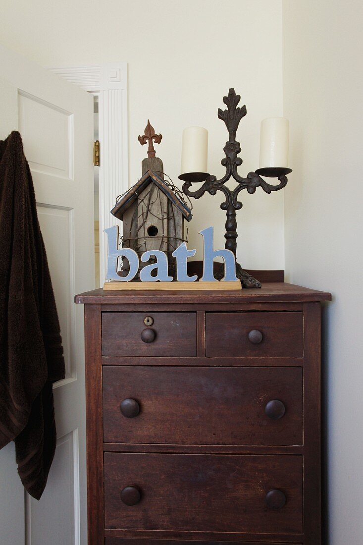 Wooden dresser behind door