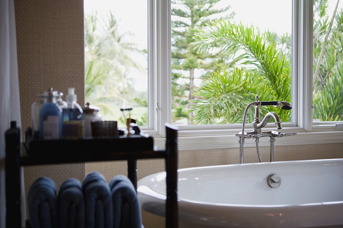 Selective focus modern bathtub near window