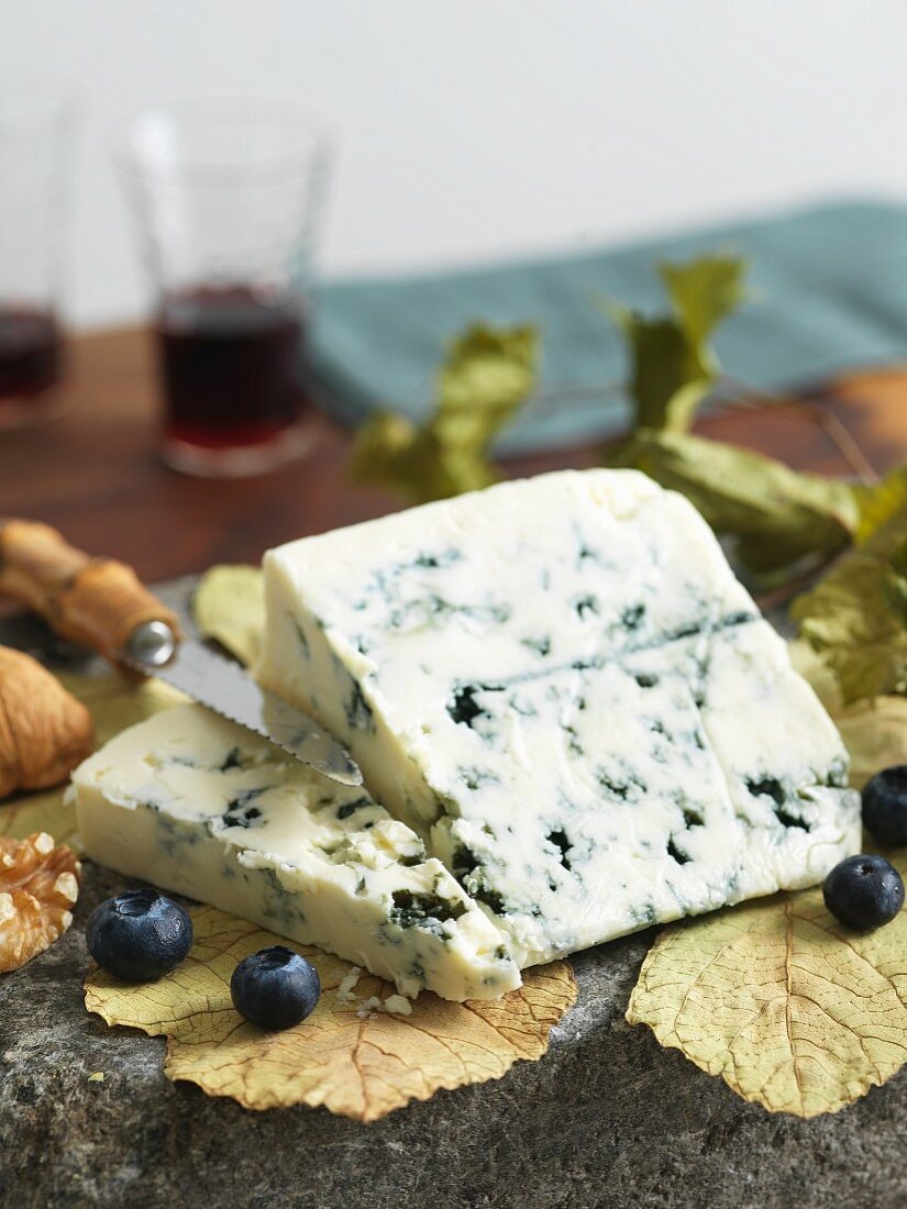 Wedge of Blue Cheese with Blueberries and Walnuts; Knife