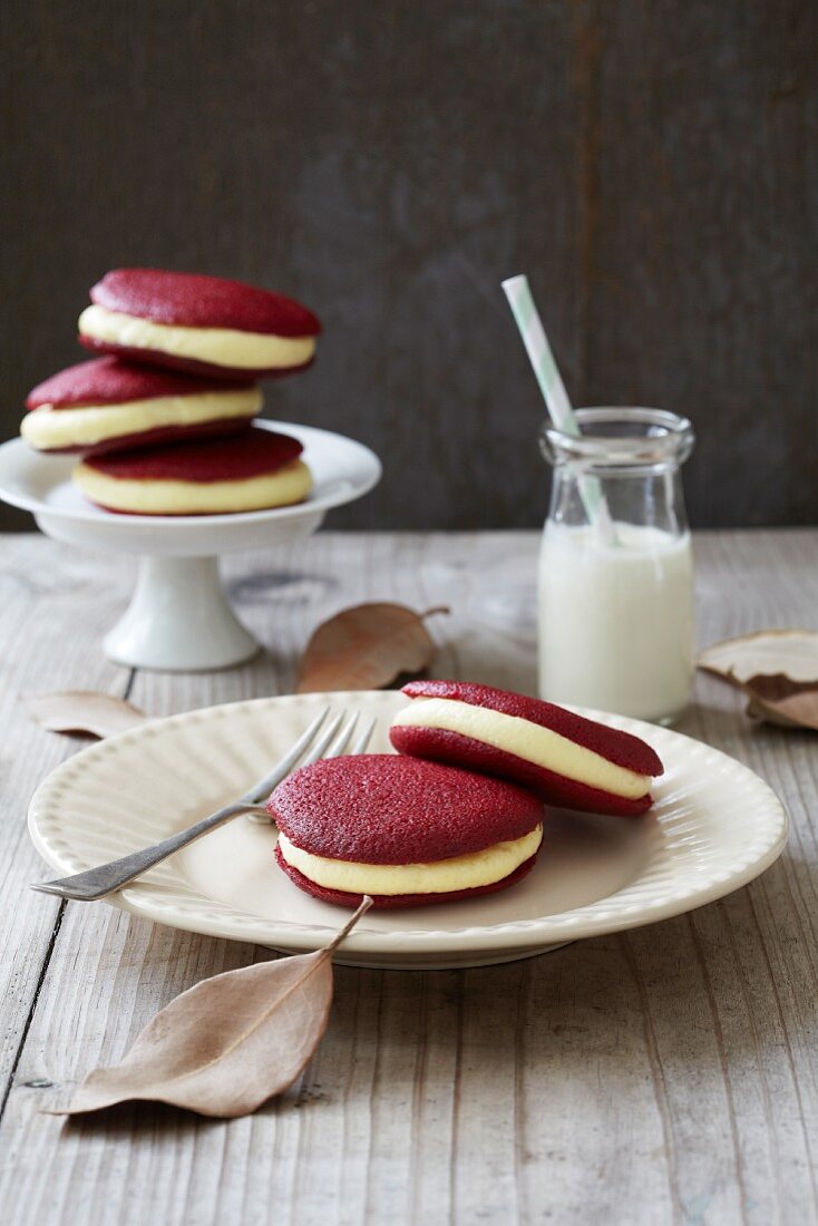 Red velvet whoopie pies filled with lemon and vanilla cream
