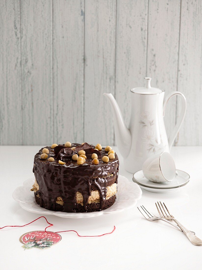 Coffee cake with chocolate glaze and hazelnuts