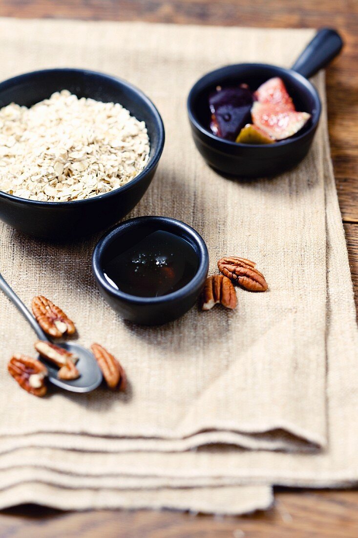 Ingredients for porridge with figs, honey and pecan nuts