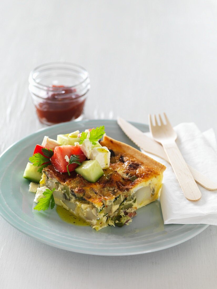 Courgette pie with bacon and a Greek salad