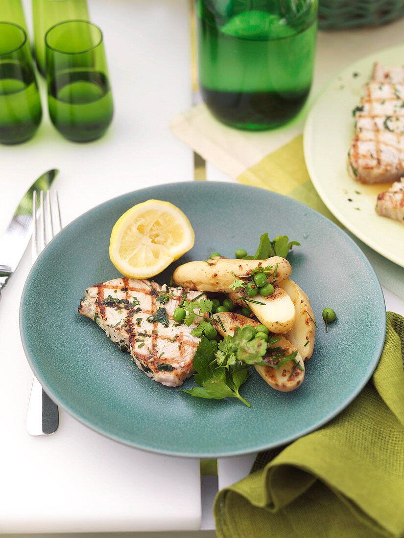 Grilled swordfish with peas, potatoes and herbs
