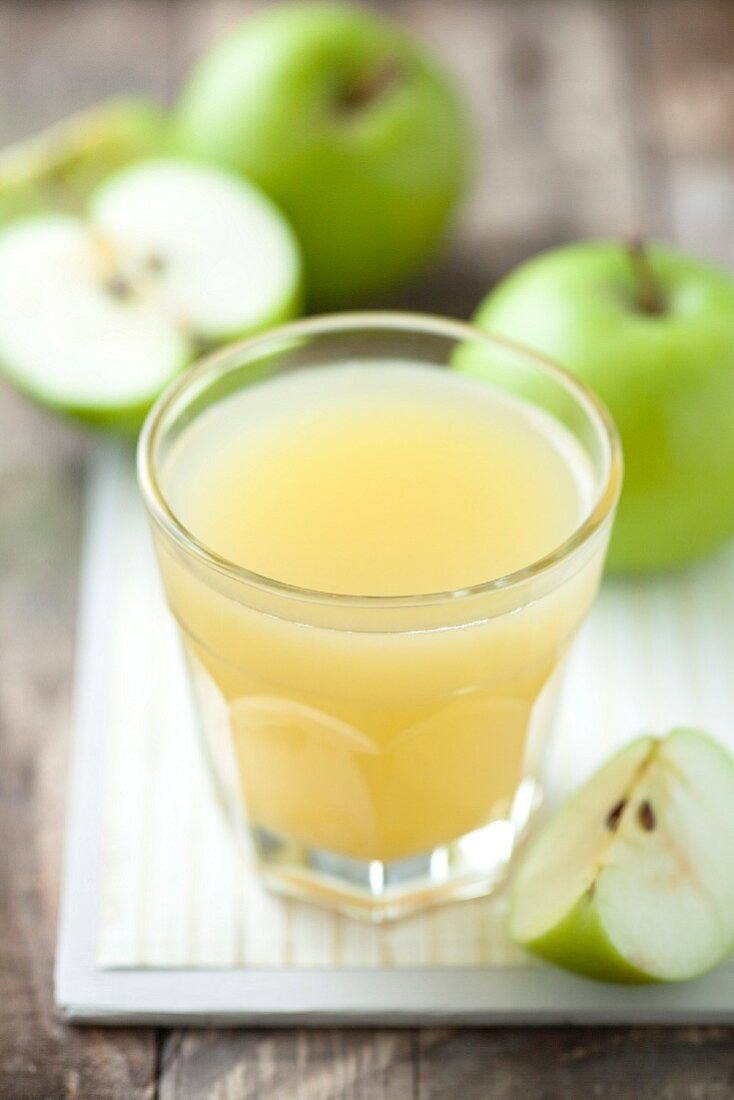 A glass of cloudy apple juice