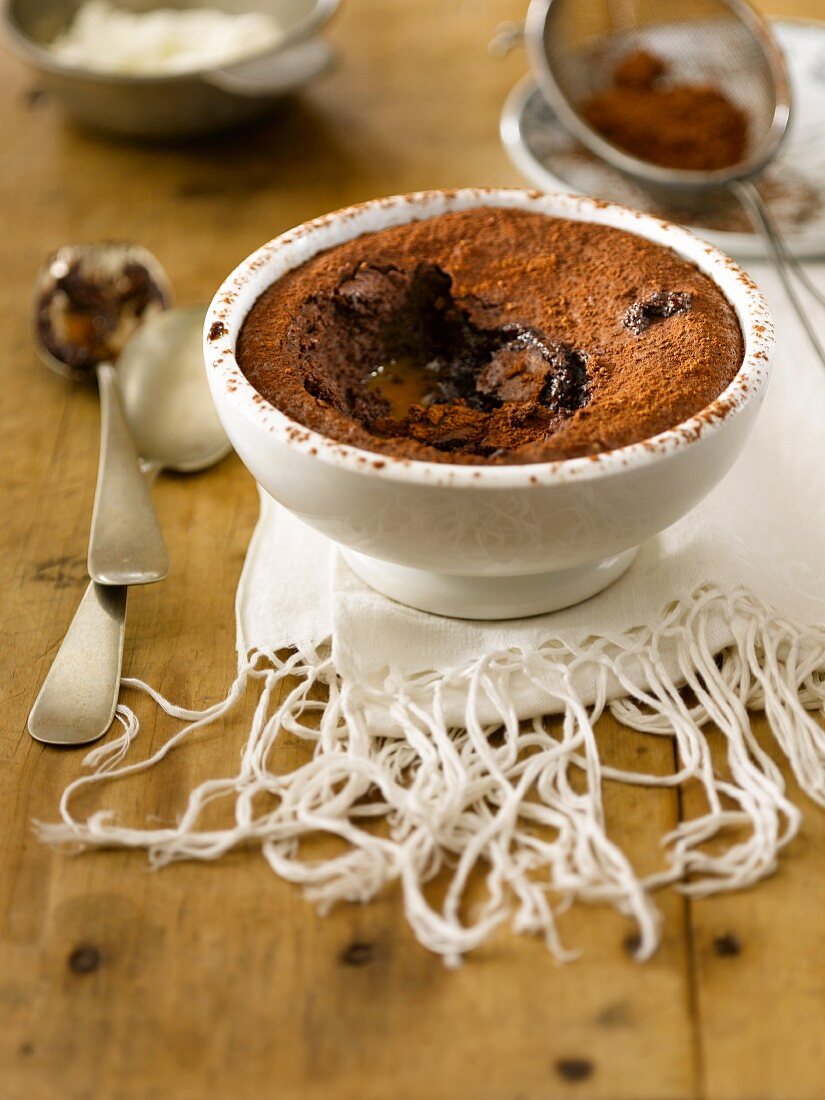 Chocolate & caramel pudding dusted with cocoa powder