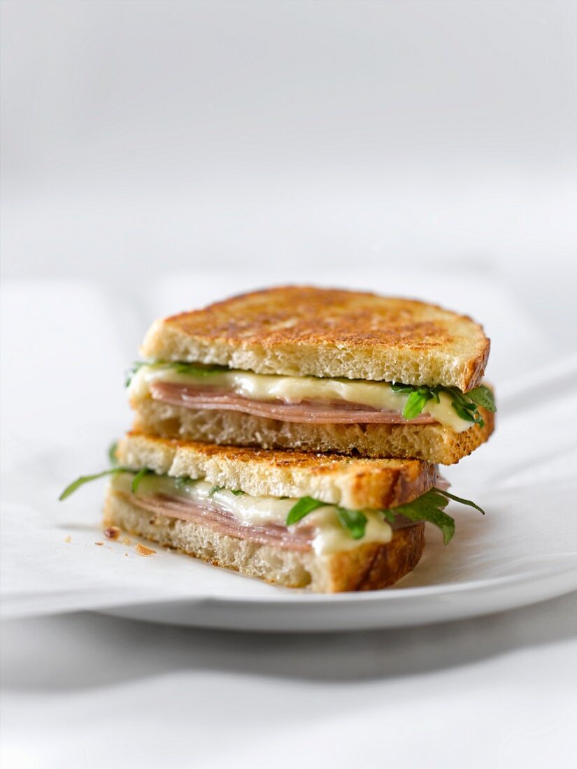 Grilled Ham and Cheese Sandwich with Arugula; Halved and Stacked