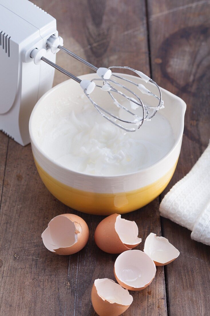 Beaten egg whites with a hand whisk