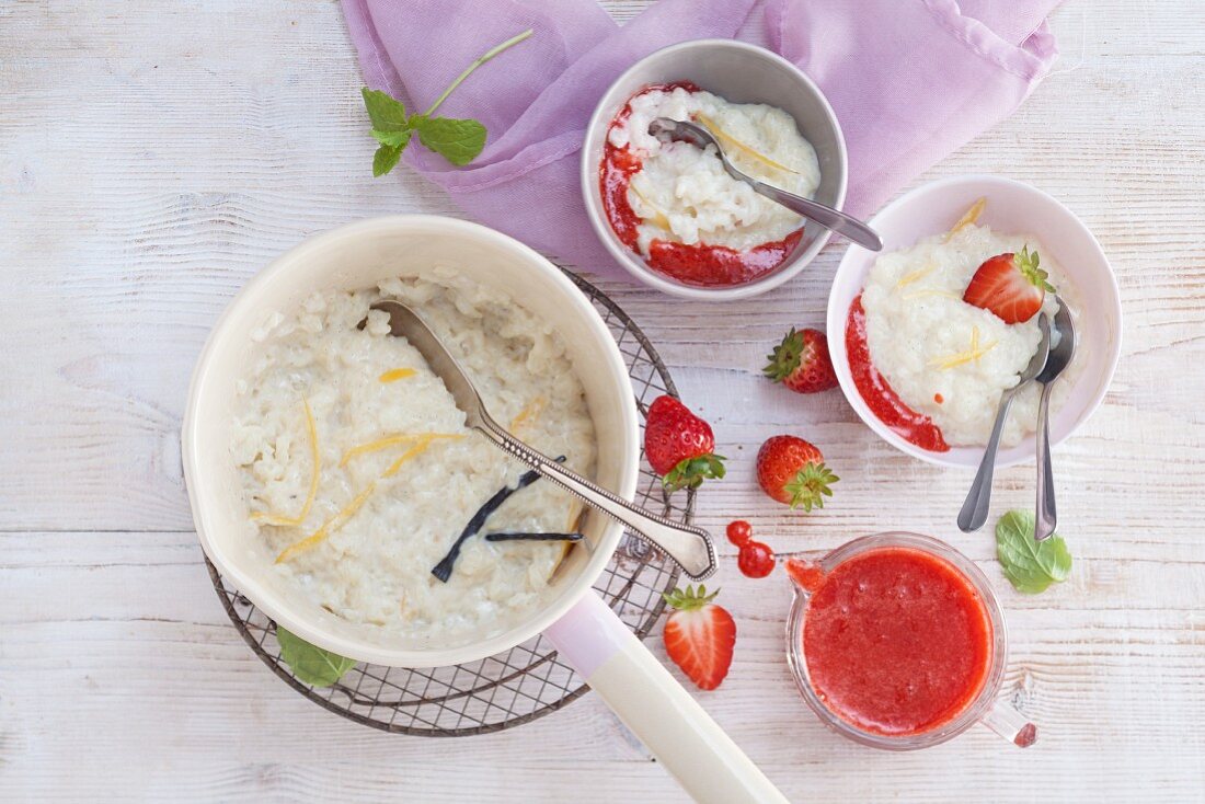 Rice pudding with lemon zest and strawberry sauce