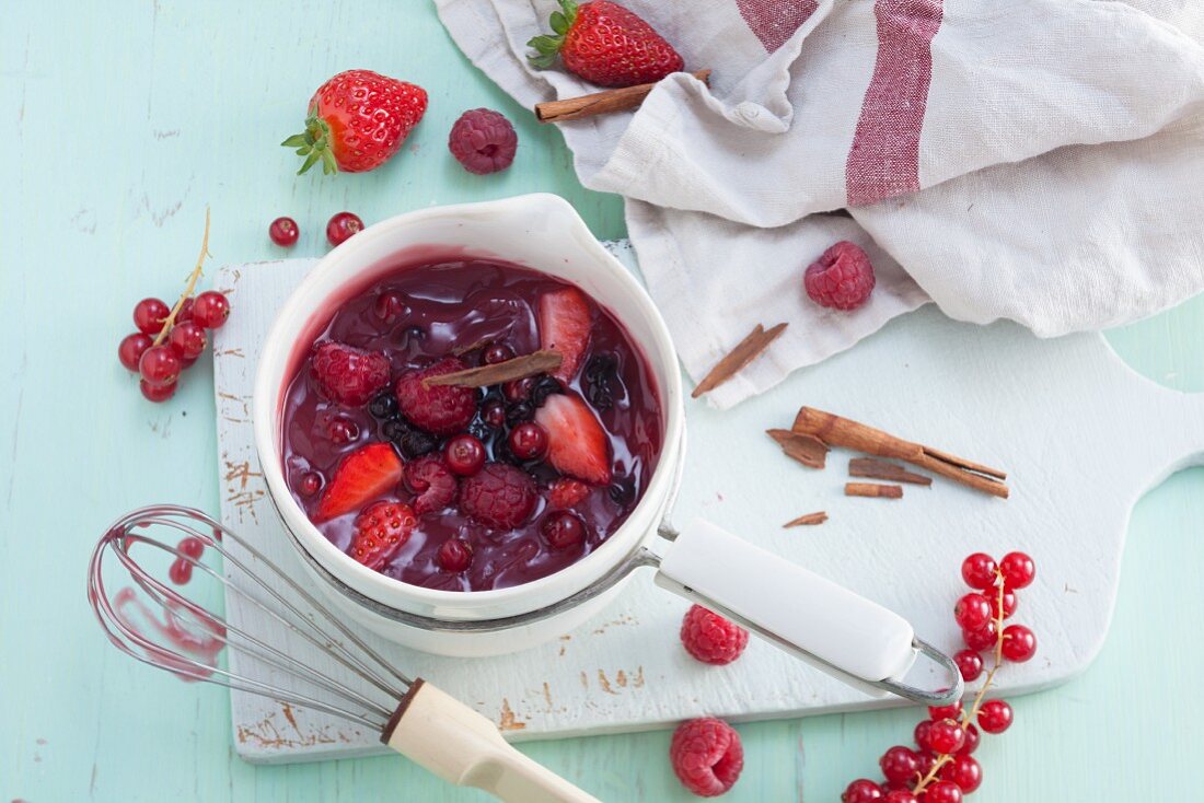 Homemade red berry compote with cinnamon