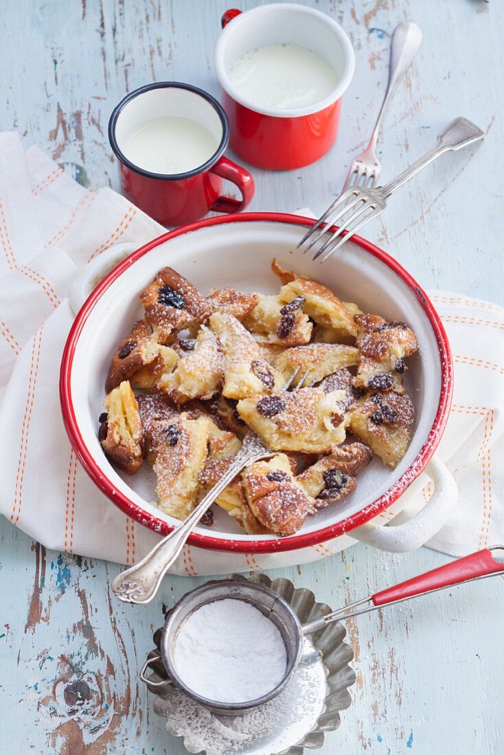 Kaiserschmarrn (shredded sugared pancake from Austria) with rum-soaked and icing sugar