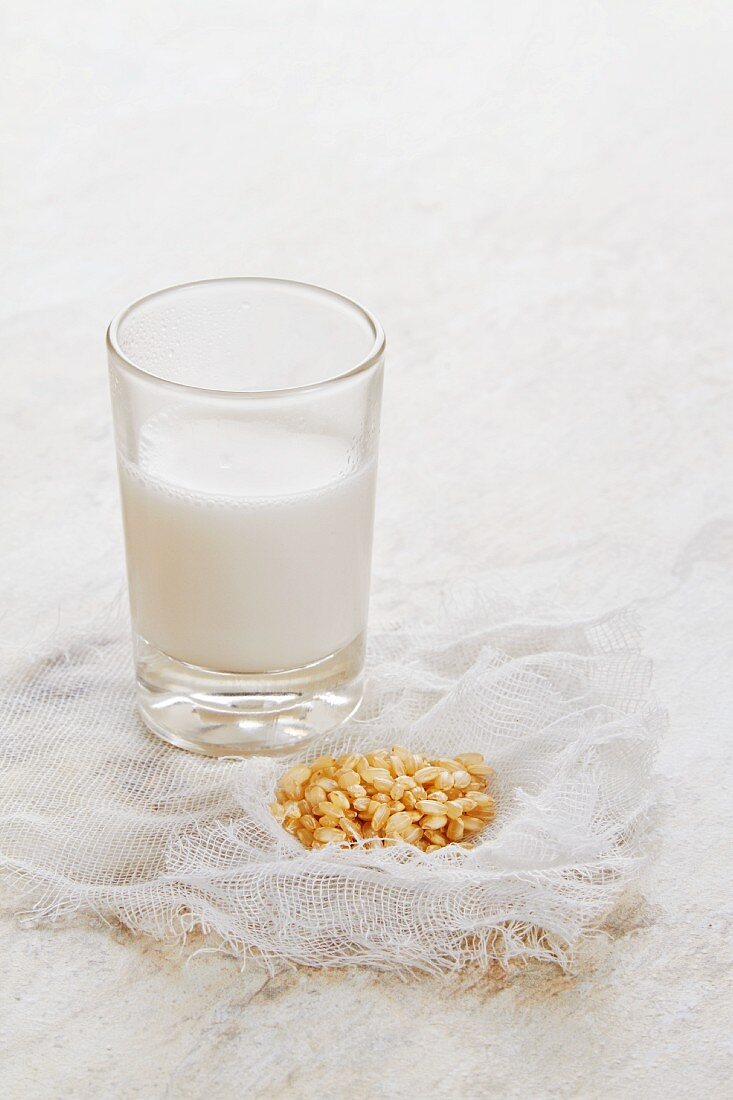 A glass of rice milk and brown rice